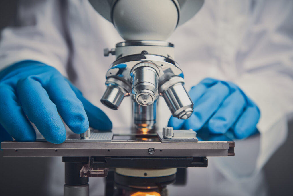 researcher with a microscope
